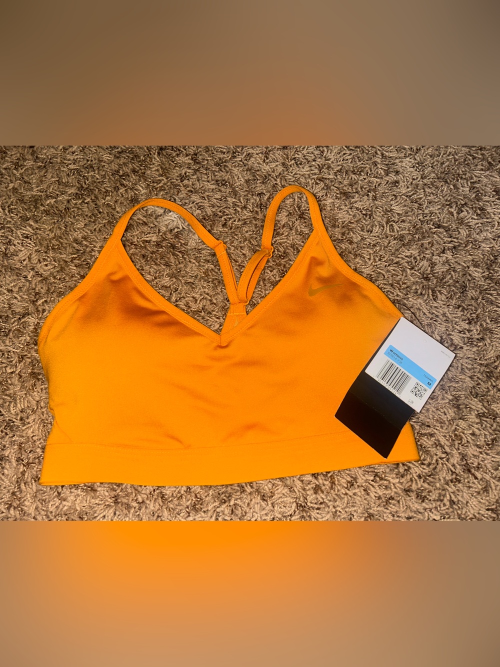 NWT Nike women's sports bra in size M with adjustable straps.